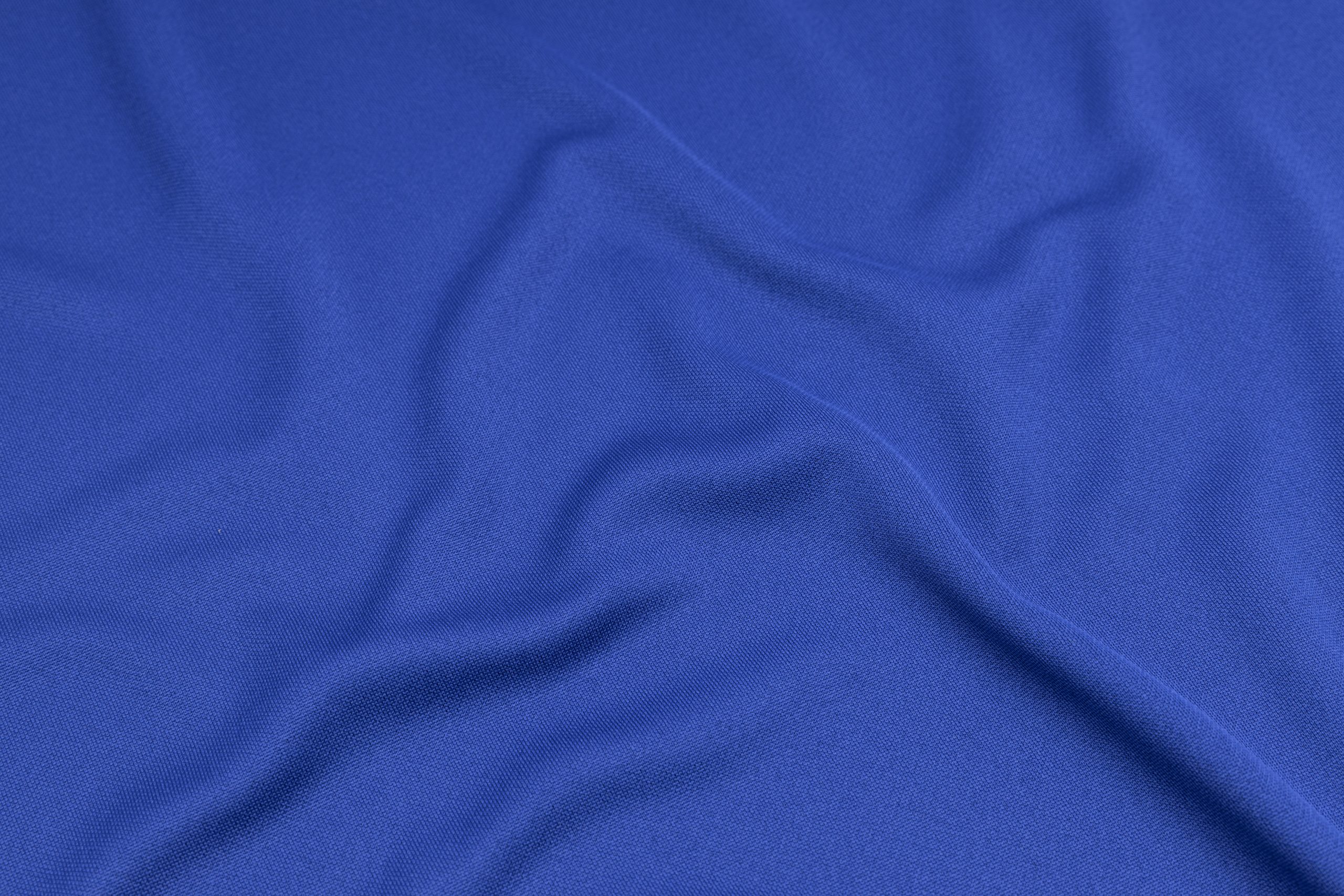 Sport Clothing Fabric Texture Background. Top View of Cloth Textile Surface. Blue Football Shirt With Copyspace Tissu bleu technique – Image 1