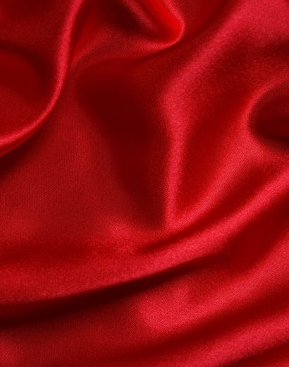 Red cloth waves background texture.